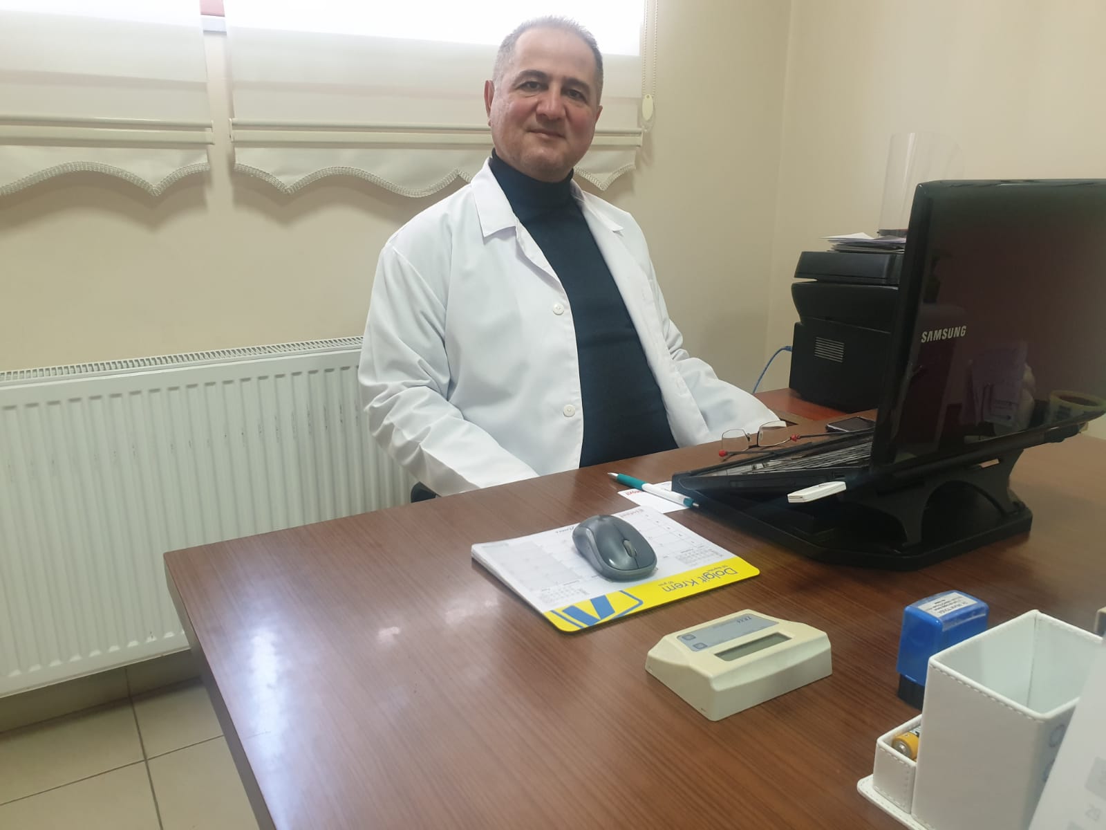 DR. MURAT TOLGA